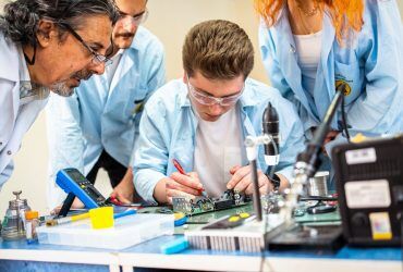 group-of-young-people-in-technical-vocational-training-with-teacher