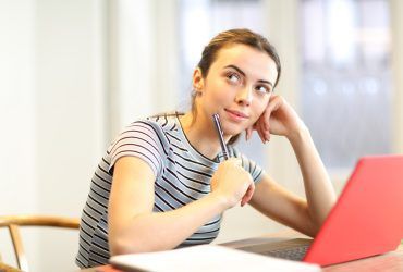 student-thinking-looking-at-side-at-home